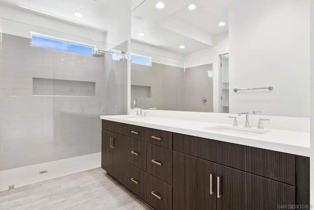 bathroom featuring vanity and a tile shower