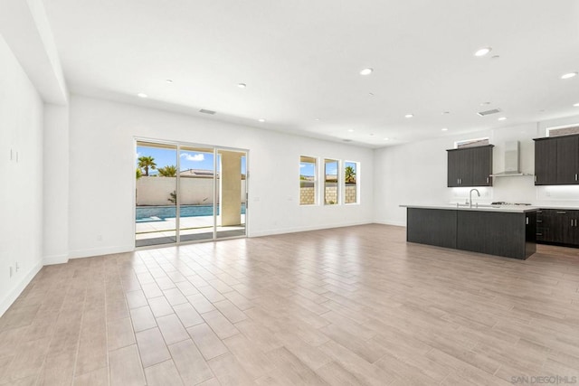 unfurnished living room with sink