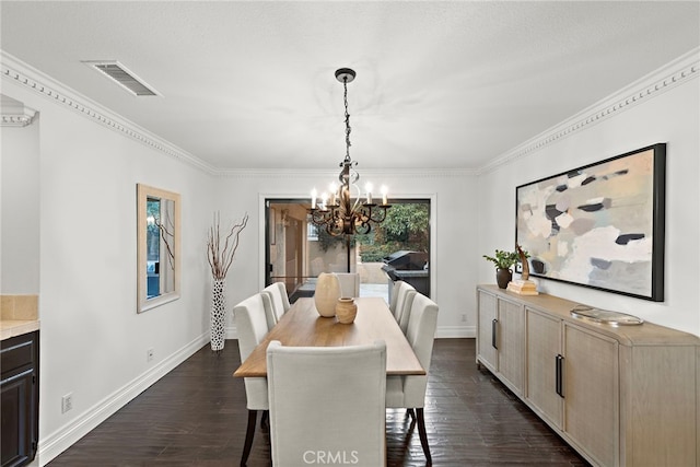 dining area with dark wood-type flooring, an inviting chandelier, and crown molding