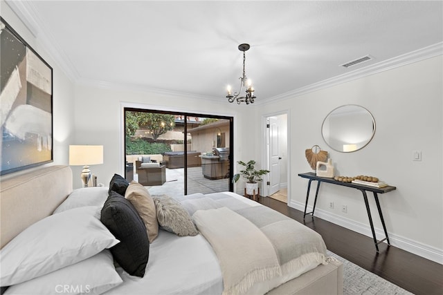 bedroom with crown molding, dark hardwood / wood-style floors, access to outside, and a chandelier