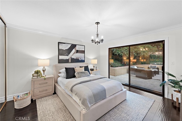 bedroom with access to exterior, an inviting chandelier, ornamental molding, and hardwood / wood-style flooring