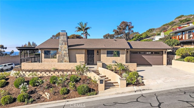 view of front of property with a garage