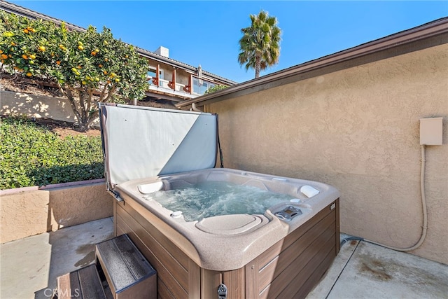 view of patio with a hot tub