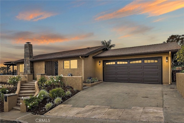 single story home featuring a garage