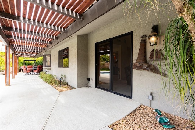 view of patio featuring a pergola