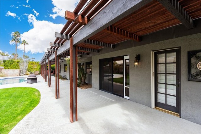 view of patio / terrace featuring a fenced in pool and a pergola