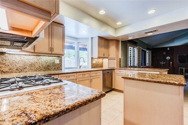 kitchen with backsplash, kitchen peninsula, appliances with stainless steel finishes, and sink