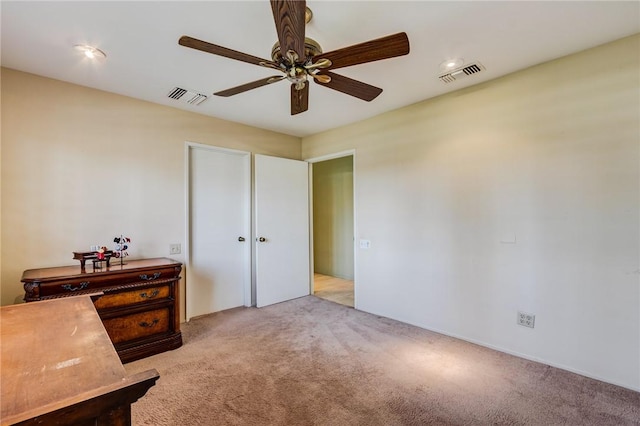 carpeted bedroom with ceiling fan