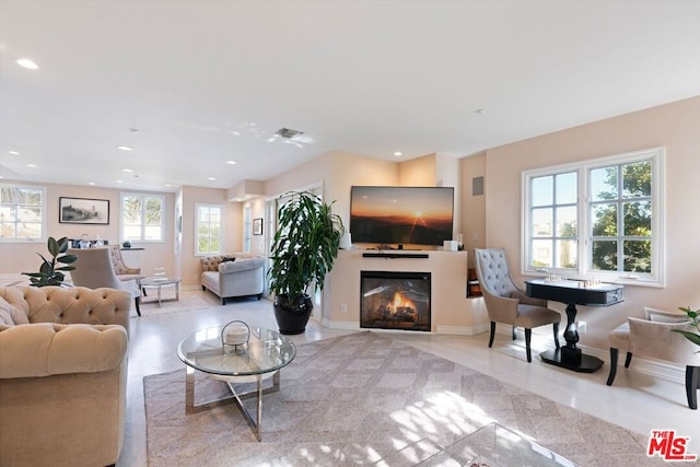 tiled living room with a wealth of natural light