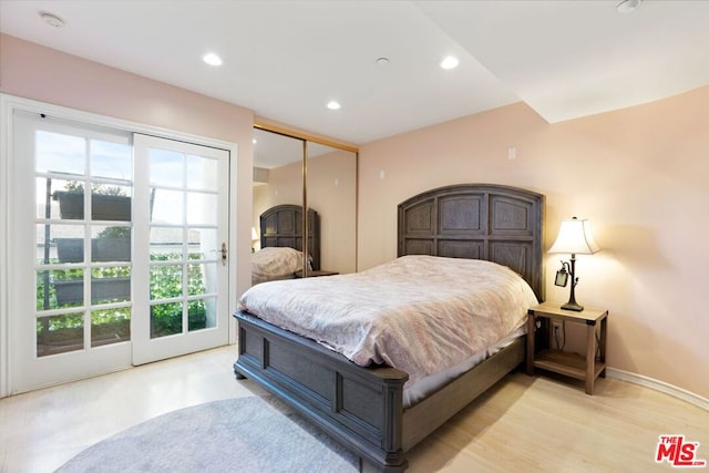 bedroom with a closet and multiple windows