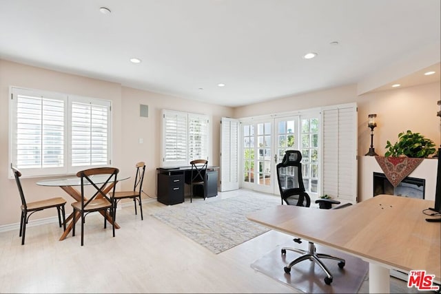 office space with light wood-type flooring