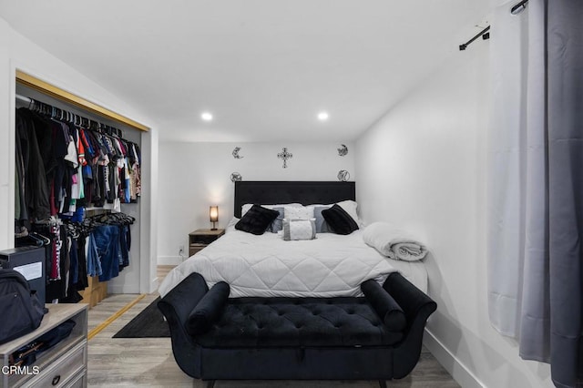 bedroom featuring a closet and light hardwood / wood-style floors