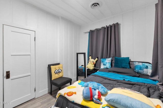 bedroom with light wood-type flooring