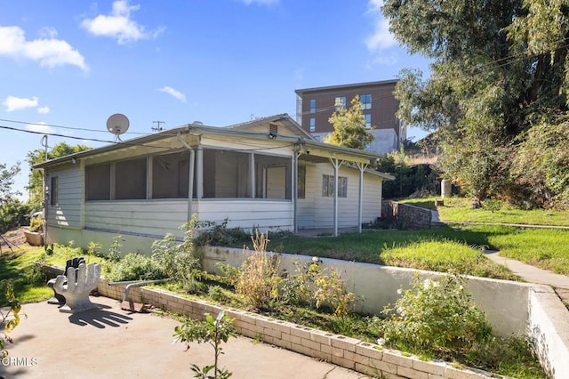 view of side of property featuring a patio