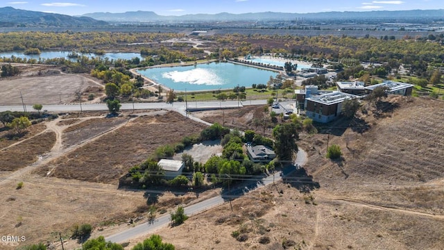 bird's eye view featuring a water and mountain view