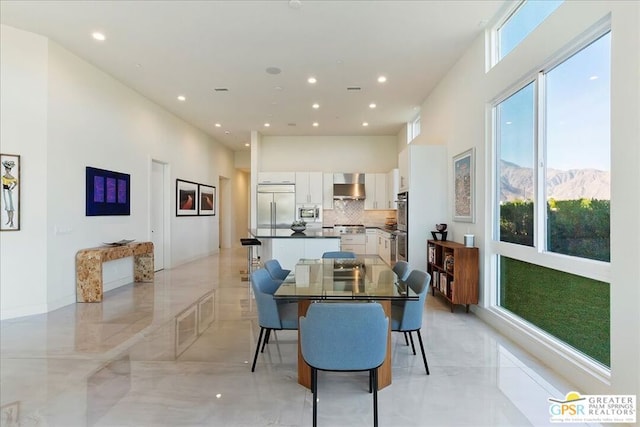 dining space with a mountain view and plenty of natural light