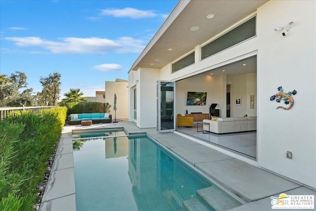 view of pool with a patio area and outdoor lounge area