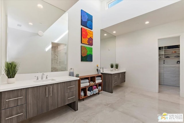 bathroom with a shower and vanity