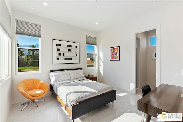 bedroom featuring multiple windows