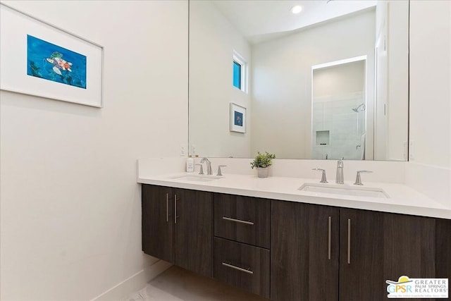 bathroom featuring an enclosed shower and vanity