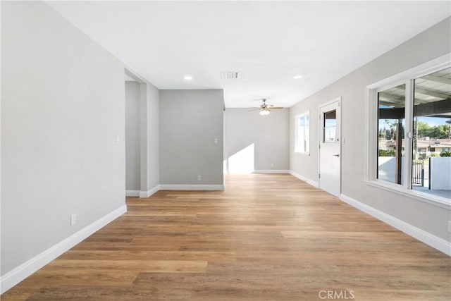 unfurnished room featuring ceiling fan and light hardwood / wood-style floors