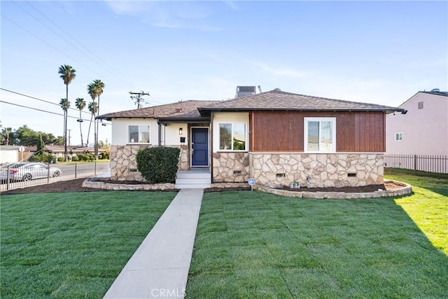 view of front of home with a front lawn and cooling unit