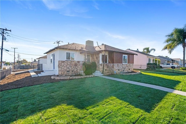 ranch-style house featuring a front yard