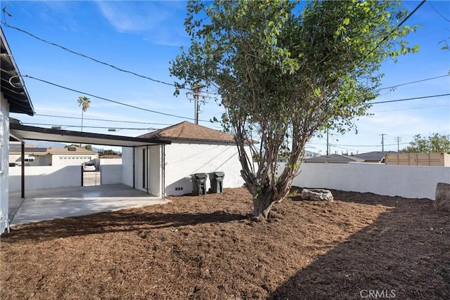 exterior space with a carport