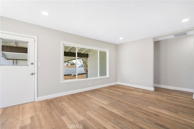 empty room featuring light hardwood / wood-style floors