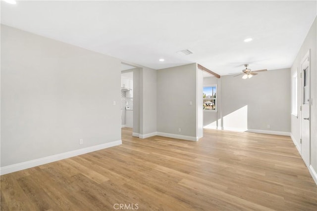 unfurnished room with ceiling fan and light hardwood / wood-style floors