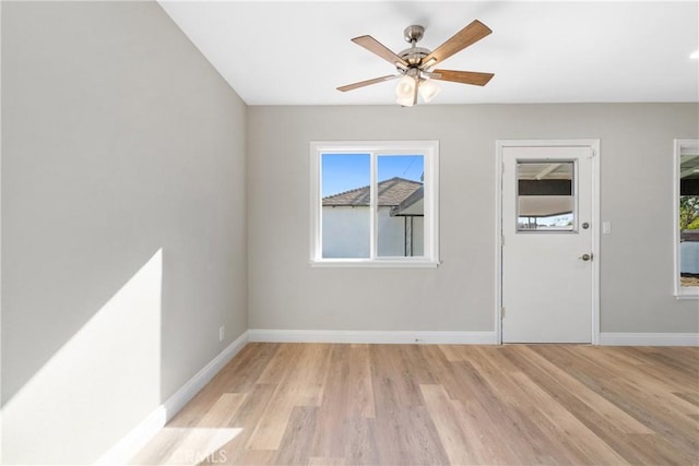 spare room with ceiling fan and light hardwood / wood-style floors