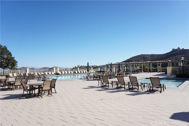 view of swimming pool featuring a mountain view