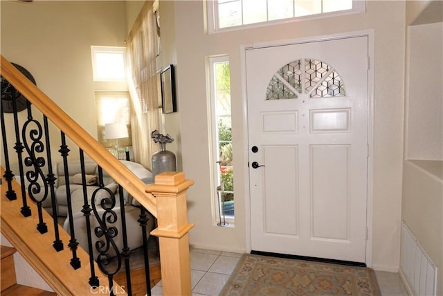 foyer with light tile patterned flooring