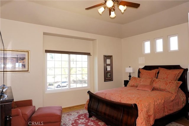 bedroom featuring hardwood / wood-style flooring and ceiling fan