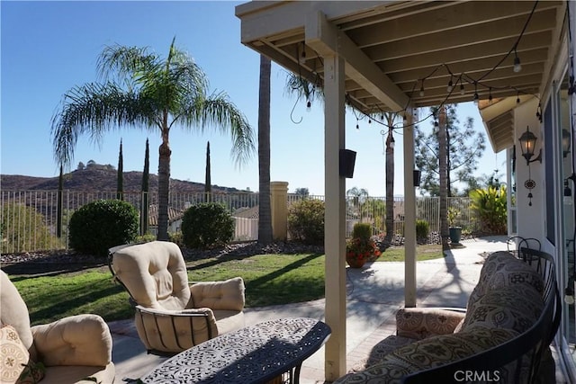 view of patio / terrace with a mountain view