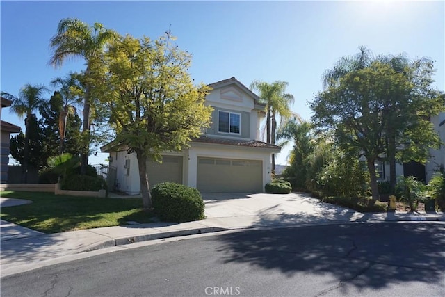 view of property hidden behind natural elements featuring a garage