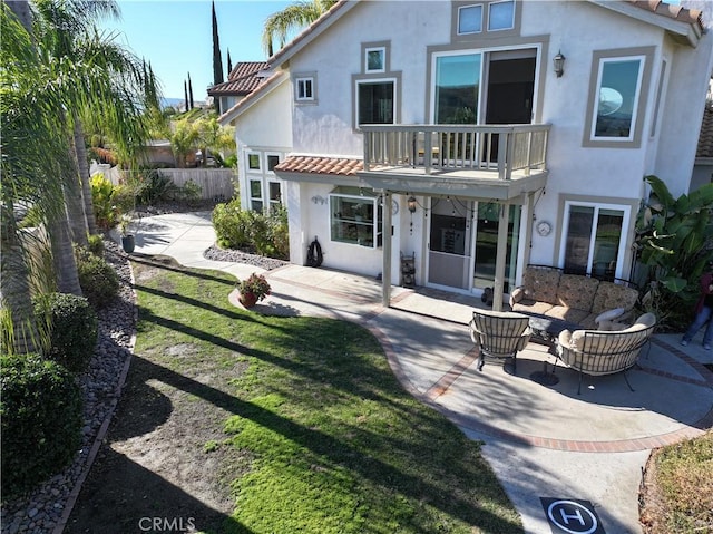 33 Corte Palazzo, Lake Elsinore, CA 92532 - rear view of property featuring stucco siding, a balcony, a patio, and a tile roof