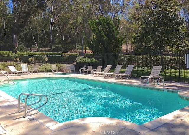 view of swimming pool featuring a patio area