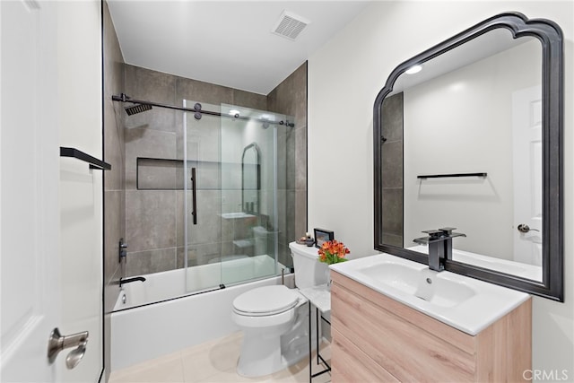 full bathroom featuring toilet, tile patterned floors, enclosed tub / shower combo, and vanity