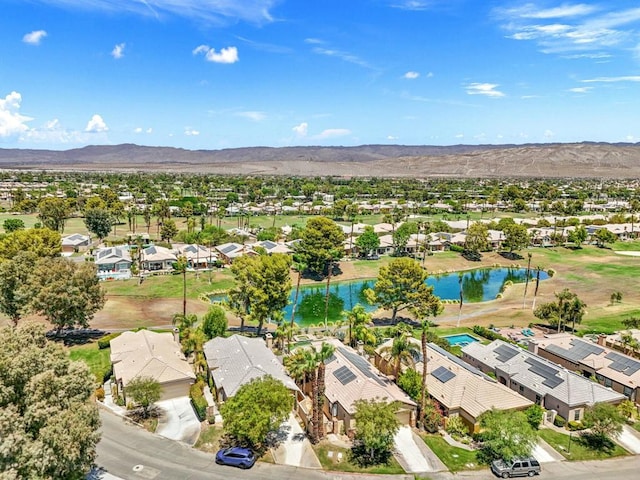 aerial view featuring a water and mountain view