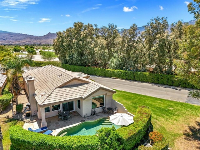 birds eye view of property with a mountain view