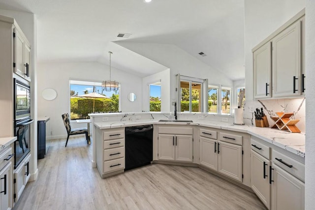 kitchen with black dishwasher, light hardwood / wood-style floors, sink, wall oven, and kitchen peninsula