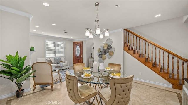 dining space with light tile patterned flooring, ornamental molding, and a chandelier