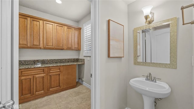 bathroom featuring tile patterned flooring and sink