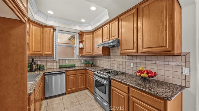 kitchen with stainless steel appliances, dark stone counters, backsplash, light tile patterned flooring, and crown molding