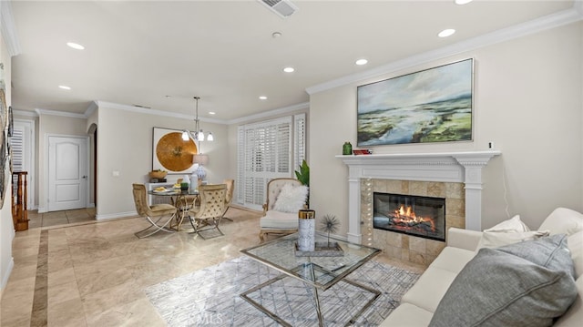 living room featuring crown molding and a fireplace