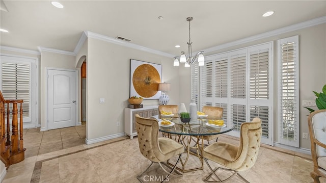 tiled dining space with ornamental molding and an inviting chandelier