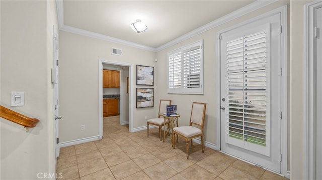 sitting room with light tile patterned flooring and ornamental molding