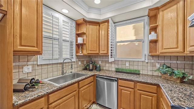 kitchen with tasteful backsplash, dark stone countertops, dishwasher, ornamental molding, and sink