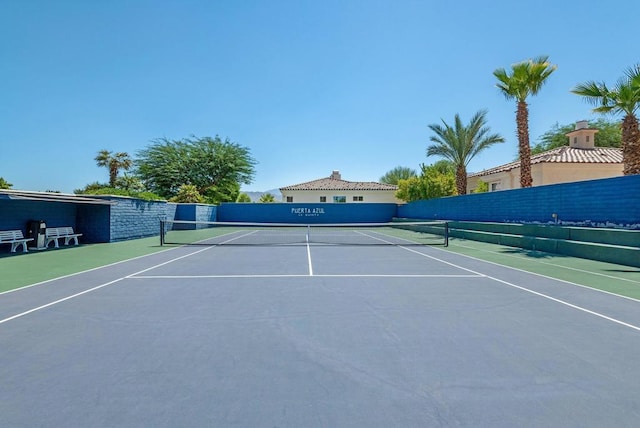 view of sport court with basketball hoop